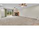 Spacious living room with a fireplace and a sliding glass door leading to an outdoor deck at 5301 Old Smith Valley Rd, Greenwood, IN 46143