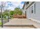 A concrete patio leads to a wooden deck, offering space for outdoor seating and entertaining at 5301 Old Smith Valley Rd, Greenwood, IN 46143