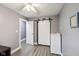 Modern bedroom features gray walls, modern floors, white doors and closets, and neutral accents at 5431 Carlton Ct, Indianapolis, IN 46224