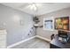 Bedroom with a home office setup, window views, and built-in cat climbing features at 5431 Carlton Ct, Indianapolis, IN 46224