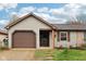 Charming single-story home with a cozy front porch and attached garage at 5431 Carlton Ct, Indianapolis, IN 46224