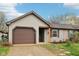 Charming single-story home with a cozy front porch and attached garage at 5431 Carlton Ct, Indianapolis, IN 46224