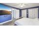 Comfortable primary bedroom with wood floors, closet storage, and a mounted television at 5431 Carlton Ct, Indianapolis, IN 46224