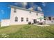 A fenced backyard with lawn, patio, outdoor seating, and barbecue grill at 5839 Altar Bell Cir, Greenwood, IN 46143
