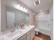 Bright bathroom featuring a double sink vanity, bathtub, and shower with stylish fixtures at 5839 Altar Bell Cir, Greenwood, IN 46143