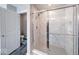 Bathroom featuring a sleek glass-enclosed shower with marble tiling and chrome shower head at 5839 Altar Bell Cir, Greenwood, IN 46143