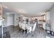 Open-concept dining area and kitchen featuring hardwood floors and ample natural light at 5839 Altar Bell Cir, Greenwood, IN 46143