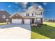 Handsome two-story home featuring brick and siding, along with a well-kept lawn at 5839 Altar Bell Cir, Greenwood, IN 46143