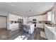 Bright kitchen with island, barstool seating, stainless appliances, and white cabinets at 5839 Altar Bell Cir, Greenwood, IN 46143