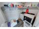 Functional laundry room with modern washer and dryer, organized storage shelves and decor at 5839 Altar Bell Cir, Greenwood, IN 46143