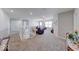 Spacious living room boasts lots of natural light and neutral paint colors at 5839 Altar Bell Cir, Greenwood, IN 46143