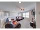 Upstairs living room with comfortable seating, ceiling fan, and ample natural light at 5839 Altar Bell Cir, Greenwood, IN 46143