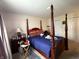 Comfortable main bedroom featuring a spacious layout, natural light, and ample closet space for storage, enhancing everyday living at 6005 Wingedfoot Ct, Indianapolis, IN 46254