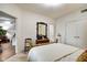 This bedroom features a brass-colored four poster bed and ensuite bathroom at 622 E 10Th St # 303, Indianapolis, IN 46202