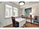 Bright dining area with natural light, hardwood floors, and stylish furnishings at 622 E 10Th St # 303, Indianapolis, IN 46202