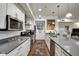 Modern kitchen with stainless appliances, white cabinets, sleek countertops, and colorful rug at 622 E 10Th St # 303, Indianapolis, IN 46202