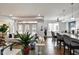 Bright living room with hardwood floors, white sofa, and view of kitchen and dining areas at 622 E 10Th St # 303, Indianapolis, IN 46202