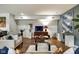 Bright living room with hardwood floors, stylish sofas, and a console table at 622 E 10Th St # 303, Indianapolis, IN 46202