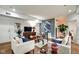Well-lit living room with hardwood floors, sofas, console, and art at 622 E 10Th St # 303, Indianapolis, IN 46202