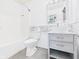 Modern bathroom with new vanity, vessel sink, stylish mirror, and tub with shower at 6233 Boulder Dr, Anderson, IN 46013