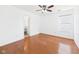 Bright bedroom with hardwood floors, neutral paint, ceiling fan, and ample natural light at 6233 Boulder Dr, Anderson, IN 46013