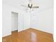 Bedroom featuring hardwood floors, a ceiling fan, a closet and bright natural light at 6233 Boulder Dr, Anderson, IN 46013