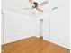 Bedroom with hardwood floors, ceiling fan, closet, and standard electrical outlets at 6233 Boulder Dr, Anderson, IN 46013