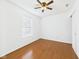 Bedroom with hardwood floors, a ceiling fan, a window and a closet at 6233 Boulder Dr, Anderson, IN 46013