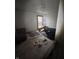 Bedroom with unmade bed, window view and showing the need for renovation and repairs at 630 Congress Ave, Indianapolis, IN 46208