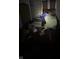 Dark bedroom filled with clutter, including a bed with disheveled linens at 630 Congress Ave, Indianapolis, IN 46208