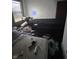 Bedroom needing repairs highlighting a window view and unmade bed at 630 Congress Ave, Indianapolis, IN 46208