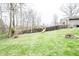 Spacious backyard boasts a playground and mature trees at 632 Ridgeview Ln, Columbus, IN 47201
