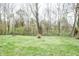 Large backyard features mature trees and landscaping at 632 Ridgeview Ln, Columbus, IN 47201