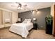 Cozy bedroom with neutral colors, ceiling fan, and stylish decorations creating a relaxing atmosphere at 632 Ridgeview Ln, Columbus, IN 47201