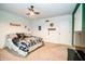 Spacious bedroom with themed decor, a ceiling fan, and ample space for personalization at 632 Ridgeview Ln, Columbus, IN 47201