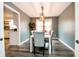 Elegant dining room with a stylish light fixture, table for six, and luxury vinyl flooring at 632 Ridgeview Ln, Columbus, IN 47201