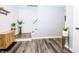 Entryway with wood-look floors, storage cabinet, and staircase at 632 Ridgeview Ln, Columbus, IN 47201