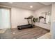 Finished basement home gym with modern treadmill and natural light at 632 Ridgeview Ln, Columbus, IN 47201