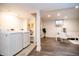 Finished basement laundry room with modern washer and dryer set and adjacent living space at 632 Ridgeview Ln, Columbus, IN 47201
