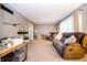 Spacious living room featuring plush seating, carpet floors and a wall desk at 632 Ridgeview Ln, Columbus, IN 47201