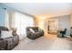 Comfortable living room featuring plush seating, carpet floors and natural light at 632 Ridgeview Ln, Columbus, IN 47201