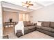 Living room featuring a ceiling fan, gray walls, and carpet at 632 Ridgeview Ln, Columbus, IN 47201