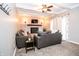 Cozy living room with brick fireplace, modern lighting and carpet at 632 Ridgeview Ln, Columbus, IN 47201