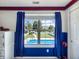 Bright bedroom view featuring a swimming pool visible through the window at 7034 Endicott Way, Indianapolis, IN 46259