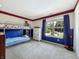 Bedroom designed with a bunk bed setup and a window that brings in natural light at 7034 Endicott Way, Indianapolis, IN 46259