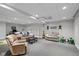 Spacious basement area with comfortable seating and storage shelves, perfect for recreation at 732 Trillium St, Lebanon, IN 46052