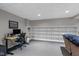 Versatile basement area with desk, open shelving, and neutral color scheme at 732 Trillium St, Lebanon, IN 46052