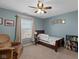 Charming bedroom with a comfortable recliner, twin bed, and natural light at 732 Trillium St, Lebanon, IN 46052