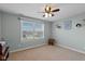 Relaxing bedroom with neutral walls, a window with blinds, and minimalist decor at 732 Trillium St, Lebanon, IN 46052