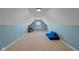 Spacious bonus room with blue accent wall, desk and sleeper sofa at 732 Trillium St, Lebanon, IN 46052